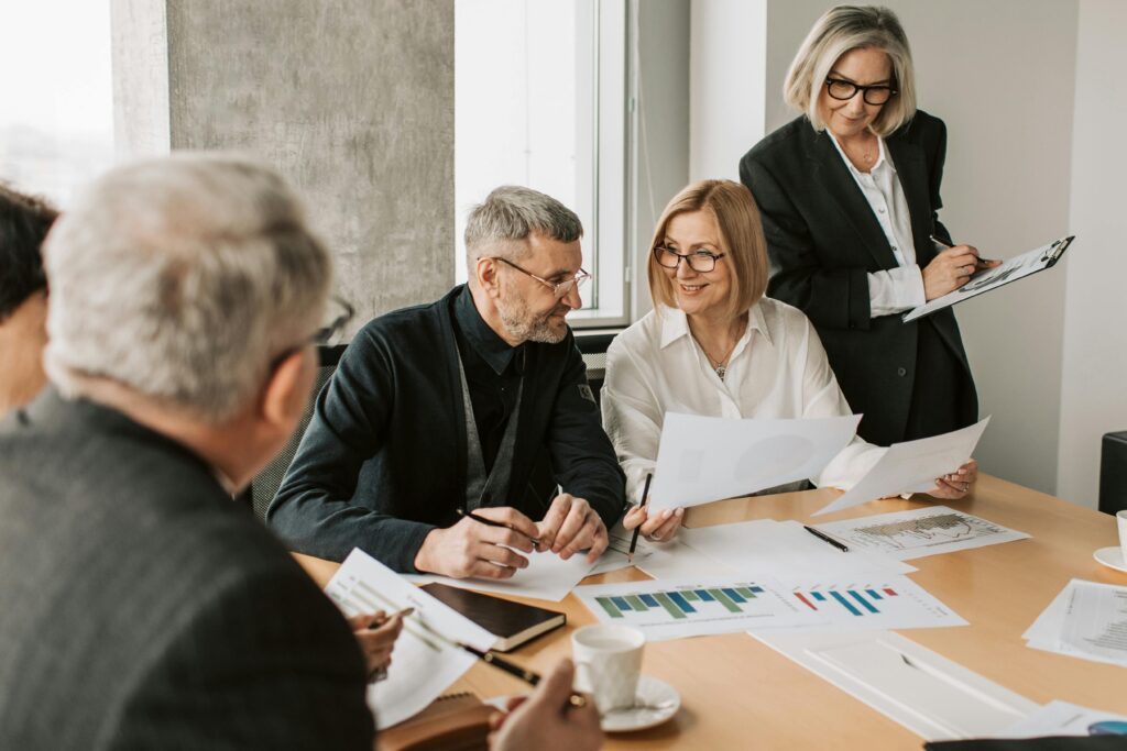 A diverse group of business professionals engaged in a strategic meeting.