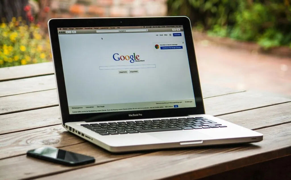 Small business owner analyzing SEO performance on laptop